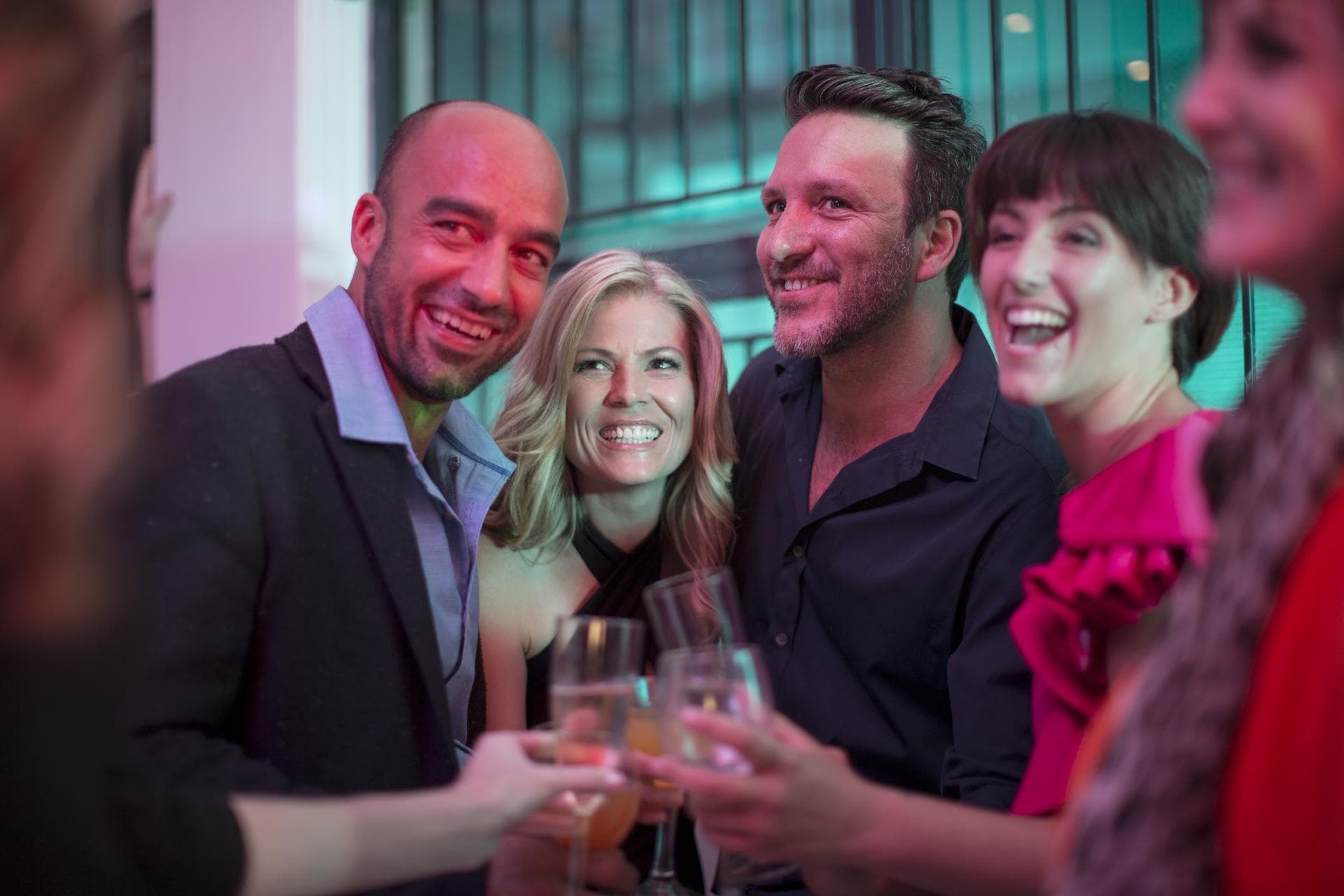 friends-toasting-with-champagne-glasses-at-party-2024-09-21-17-52-24-utc