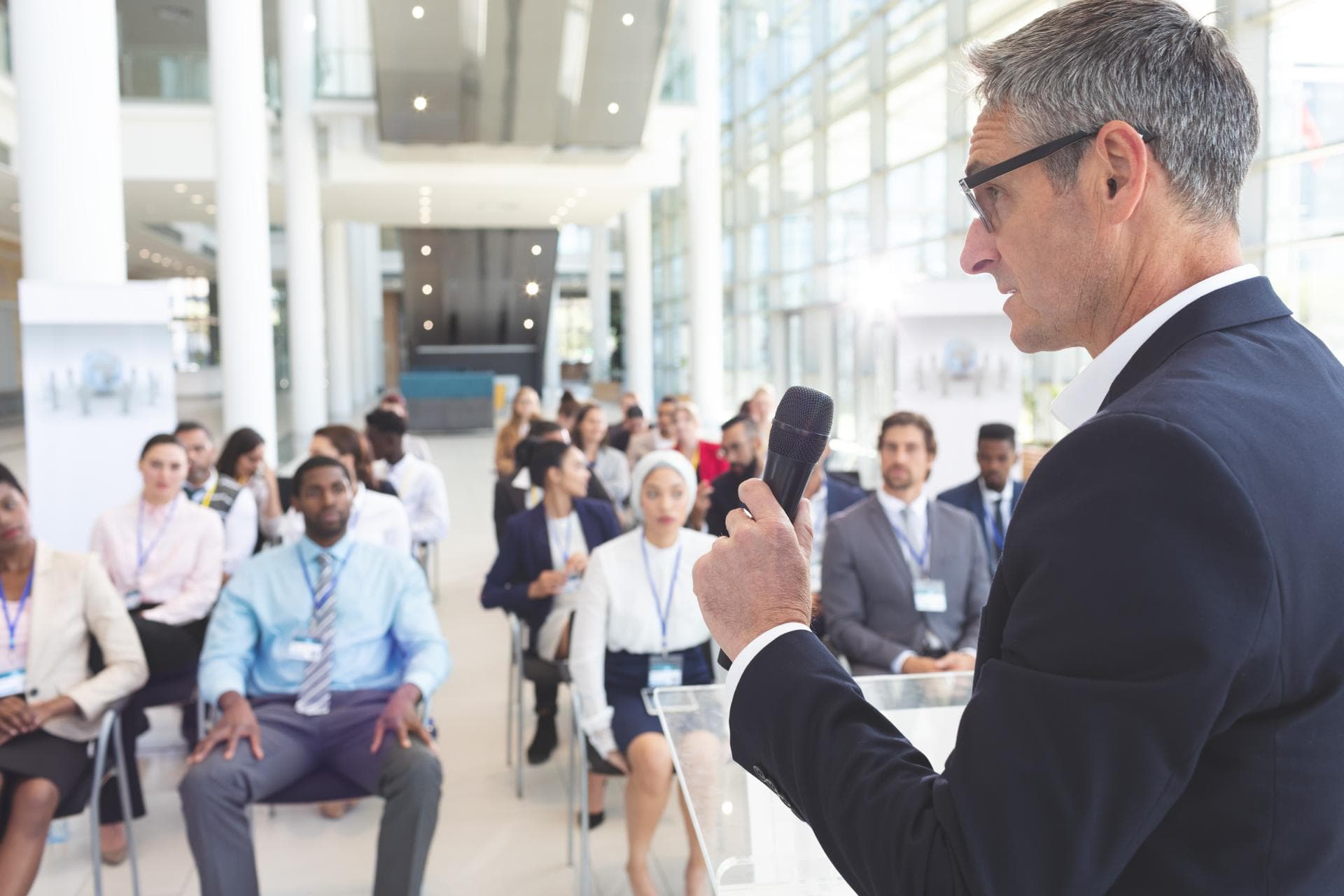 male-speaker-speak-to-diverse-business-people-in-2025-04-04-09-45-36-utc